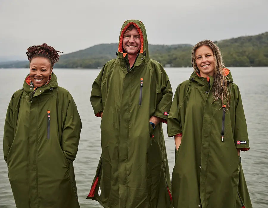 3 people wearing the pro change robes, smiling at the camera