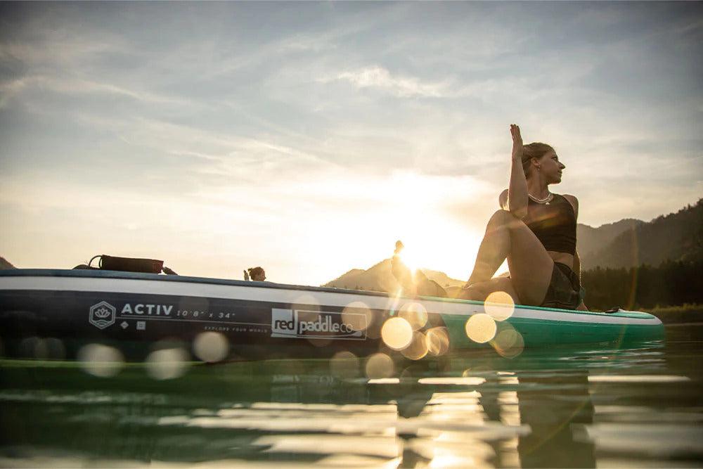 woman sitting on paddleboard