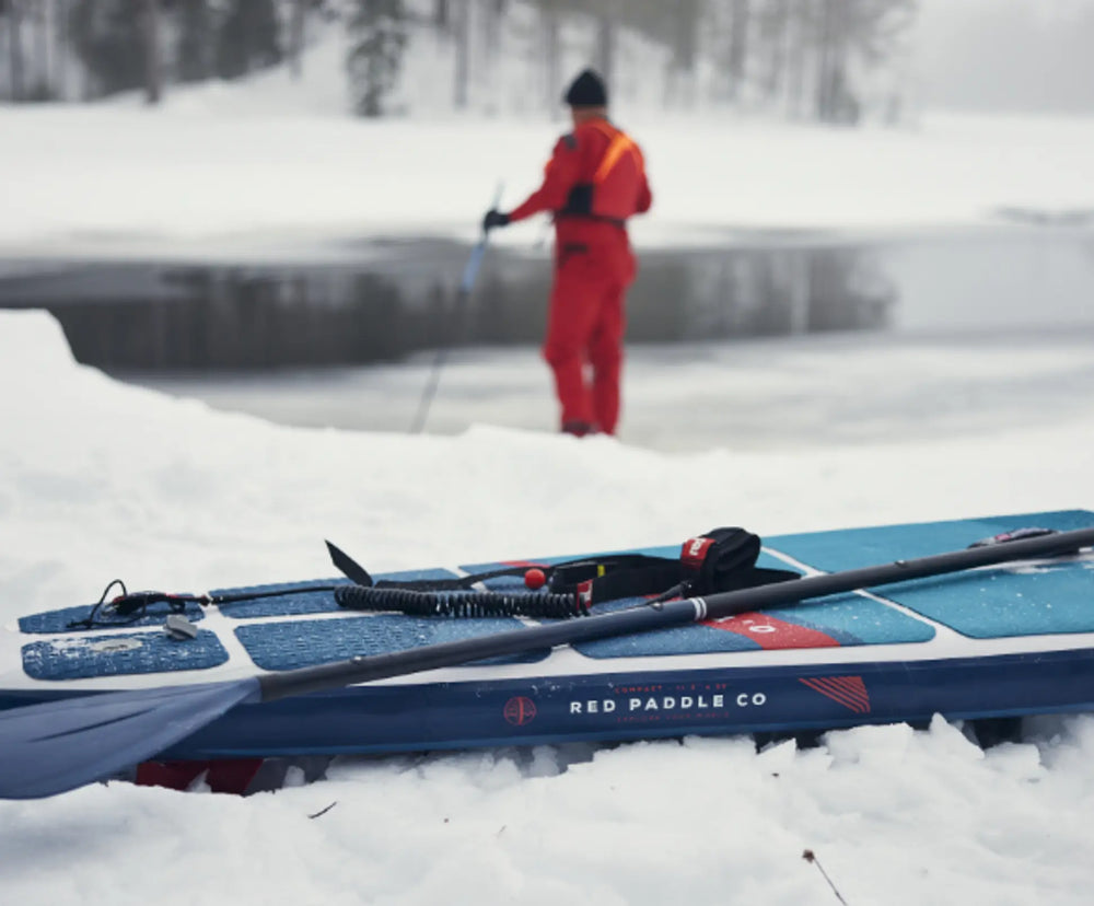 close up of paddleboard on snow