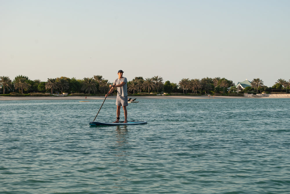 man paddling on his paddleboard on the ocean