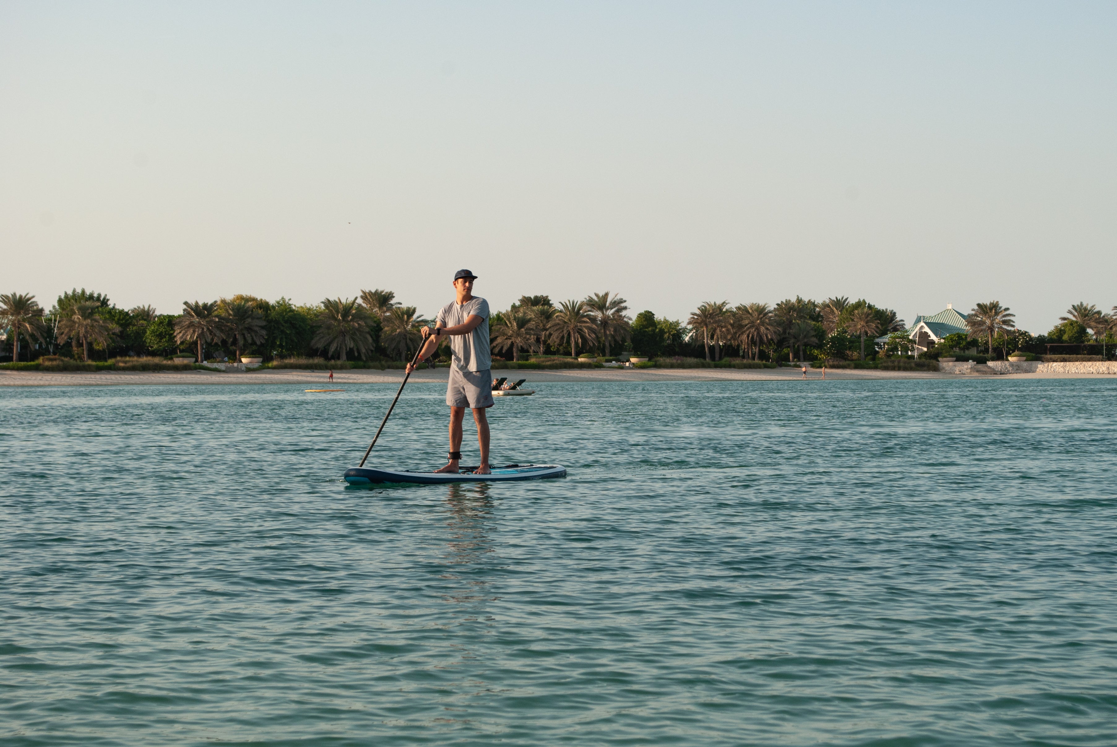 man paddling on his paddleboard on the ocean