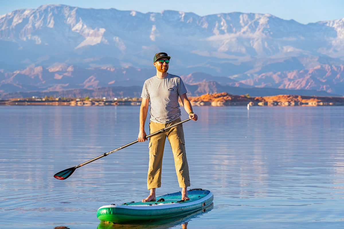 person paddle boarding at sand hollow