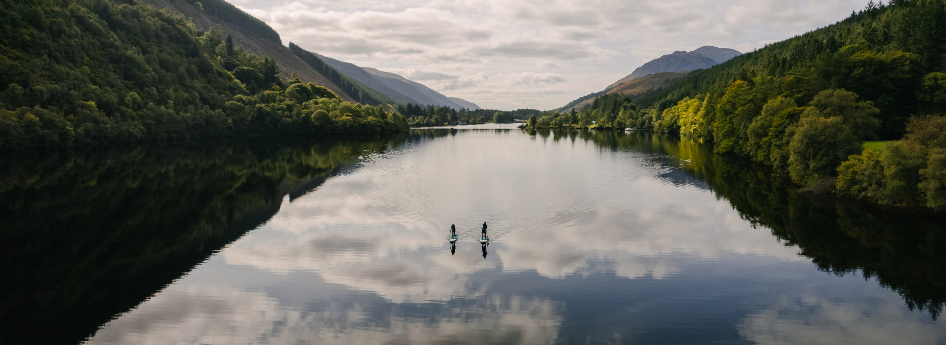 2 people paddleboarding on a lake