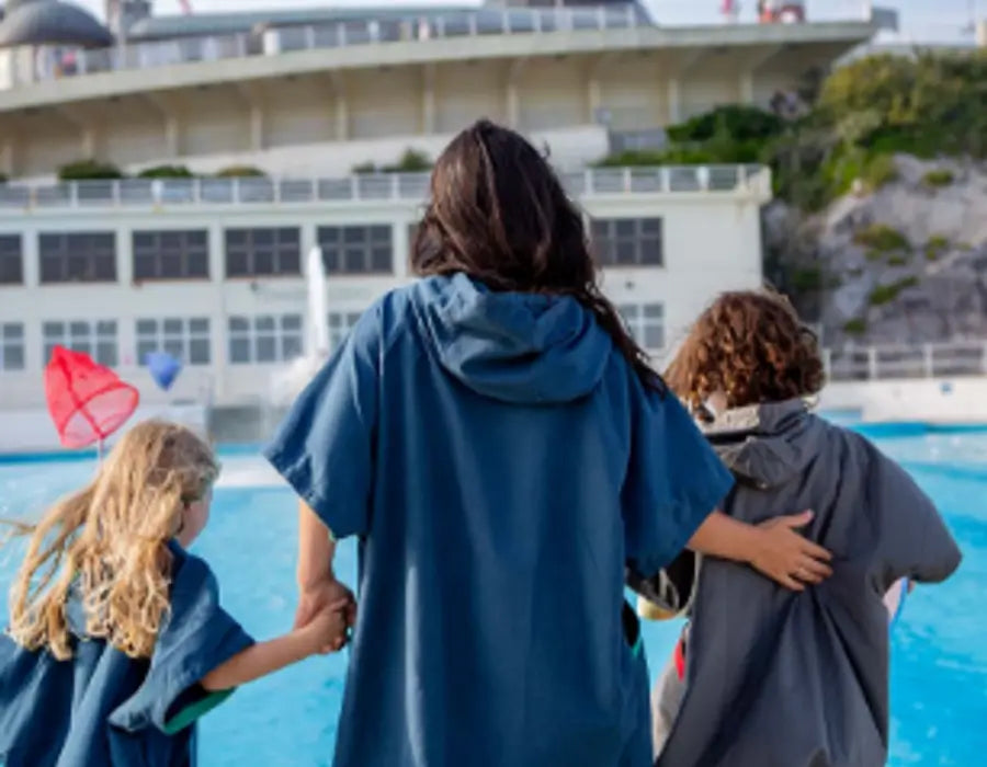 Woman and two children at swimming pool