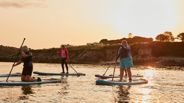 group of women on paddleboards