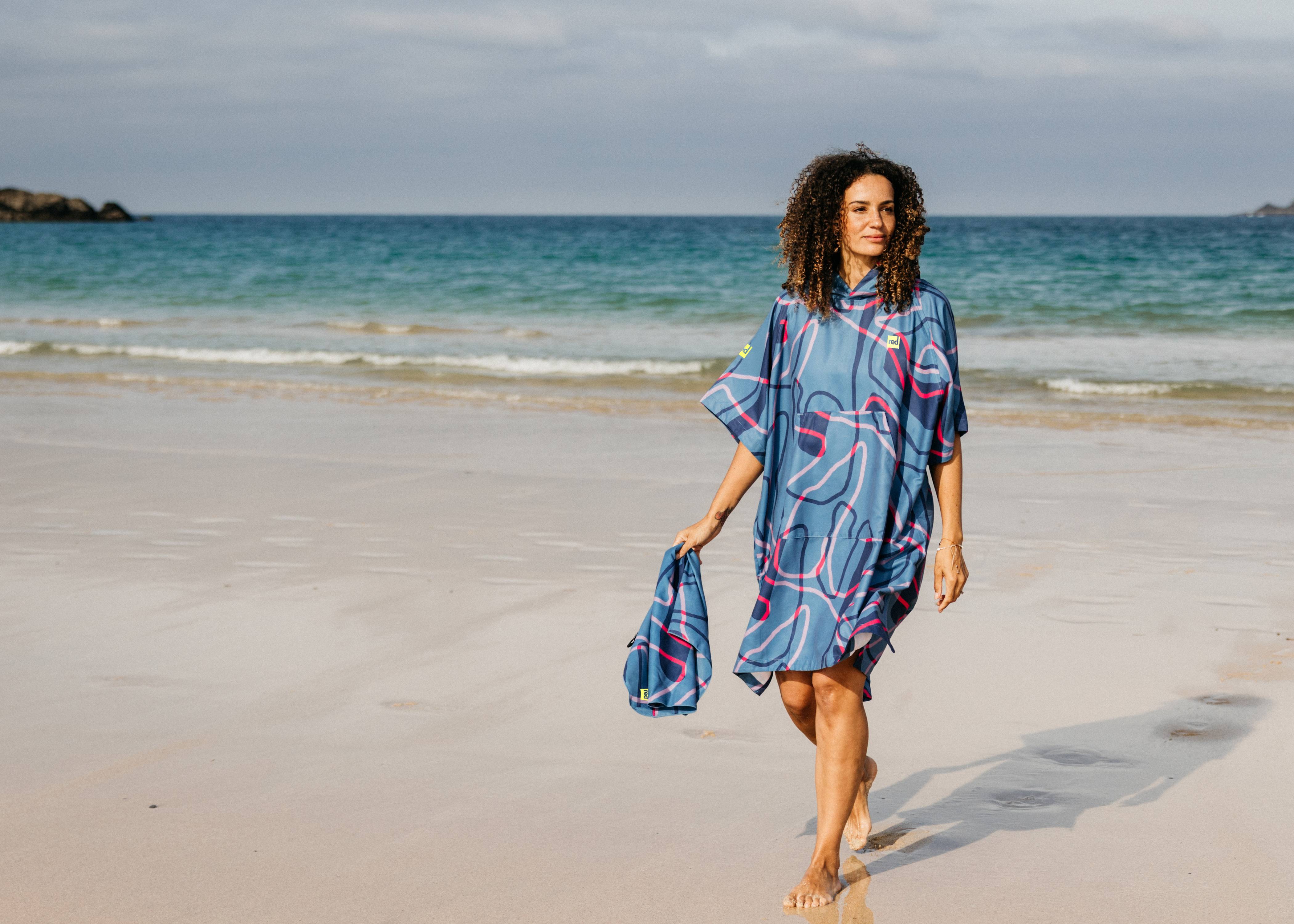 beach changing dress Young blond woman is changing clothes at the beach Stock Photo